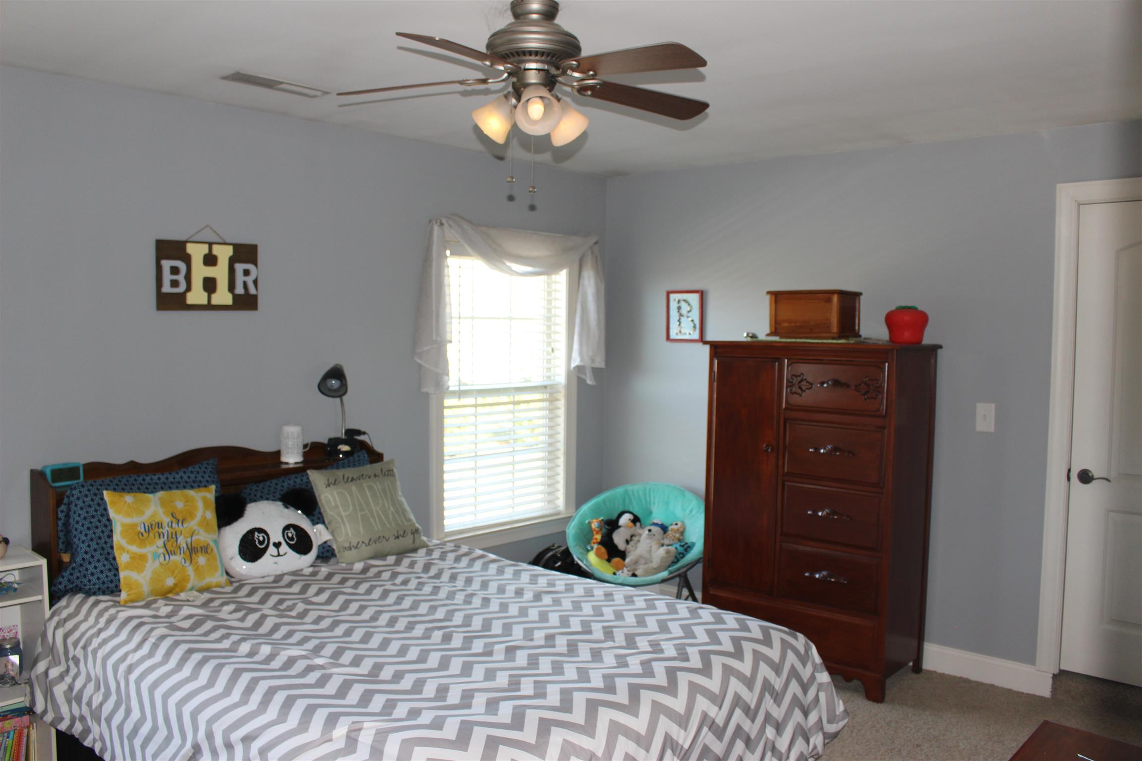 116 New Dawn Road Rockvale, TN 37153 - Photo 17 of 26 a bedroom with a bed and a window