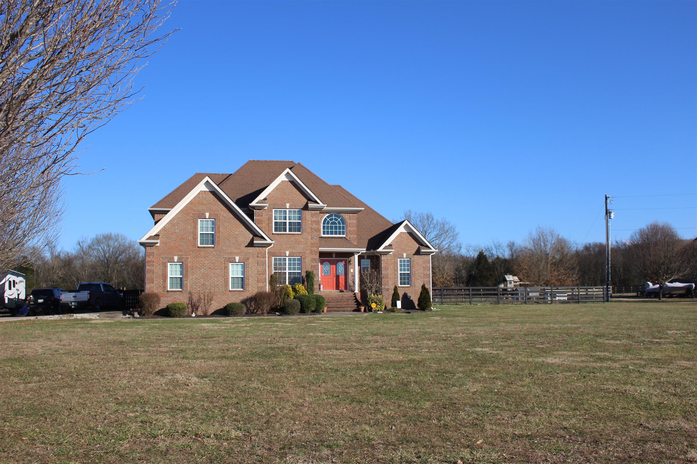 116 New Dawn Road Rockvale, TN 37153 - Photo 2 of 26 a front view of a house with a yard