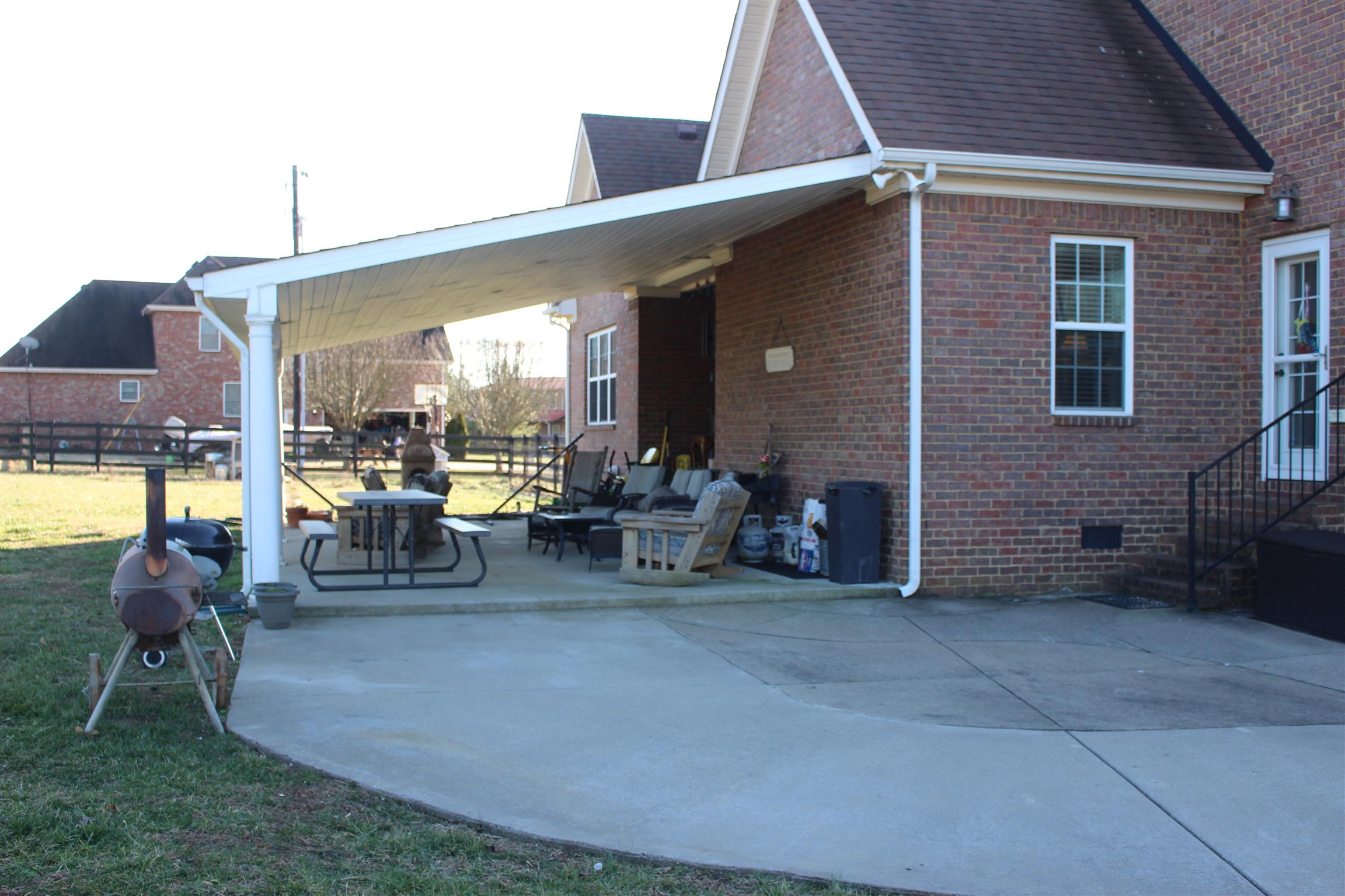 116 New Dawn Road Rockvale, TN 37153 - Photo 24 of 26 a view of a patio with dining table and chairs