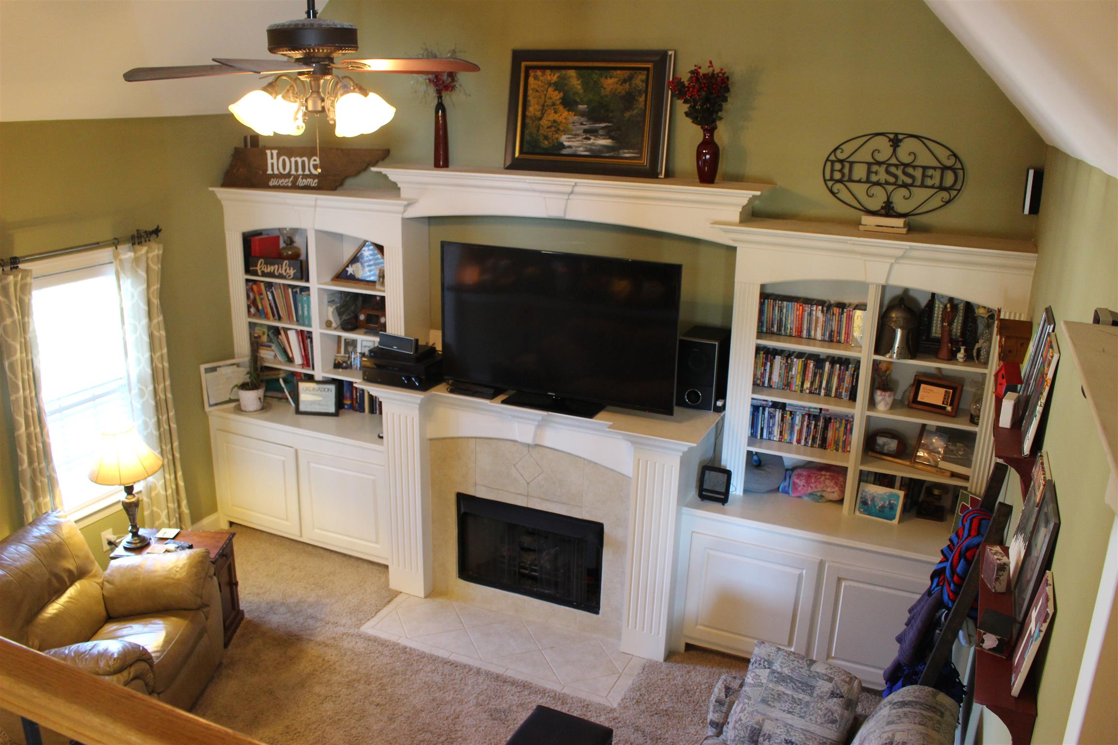 116 New Dawn Road Rockvale, TN 37153 - Photo 10 of 26 a living room with a fireplace and a chandelier