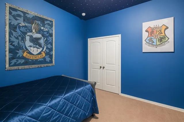 a bedroom with a bed and a cabinets