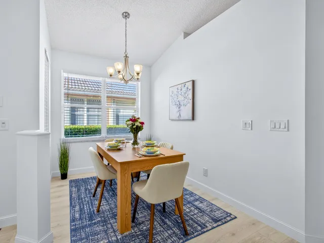a view of a dining room with furniture window and outside view