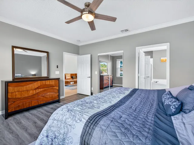 a bedroom with a bed and dresser