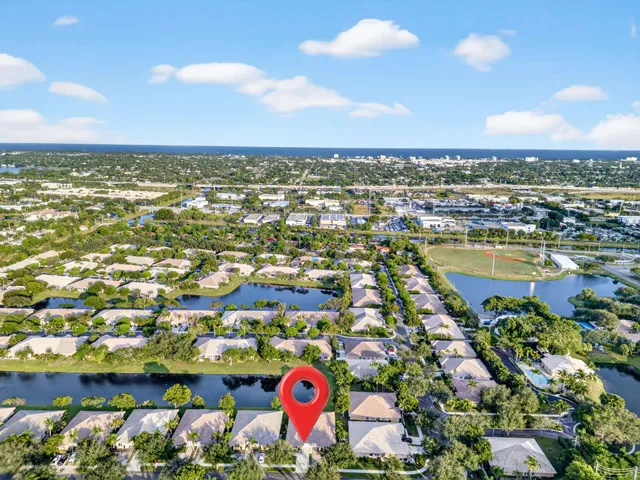 an aerial view of residential houses with outdoor space