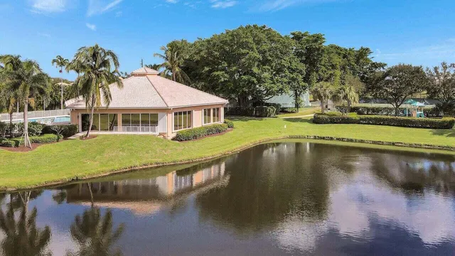 a room with gym equipment and large windows