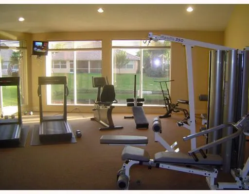 a view of a swimming pool with outdoor seating