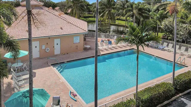 a view of swimming pool with a table and chairs
