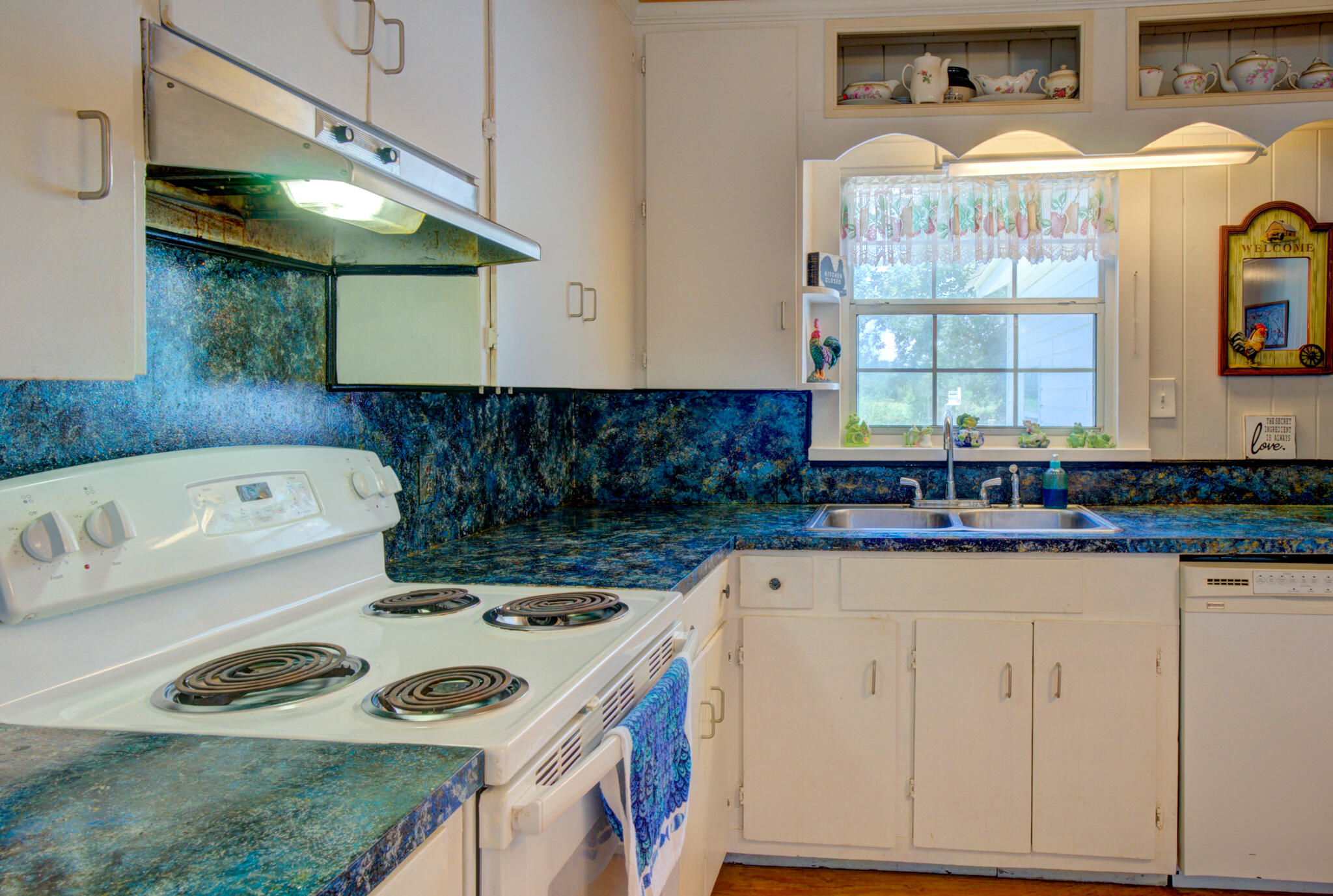 4135 Cliff Road Graceville, FL 32440 - Photo 13 of 40 a kitchen with a stove and a sink