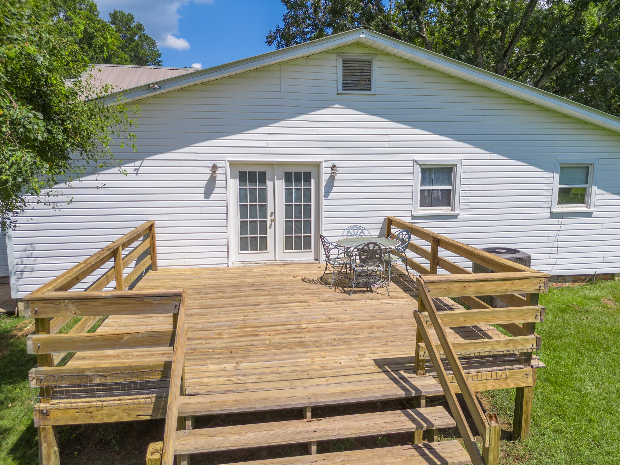 4135 Cliff Road Graceville, FL 32440 - Photo 28 of 40 a front view of a house with a yard