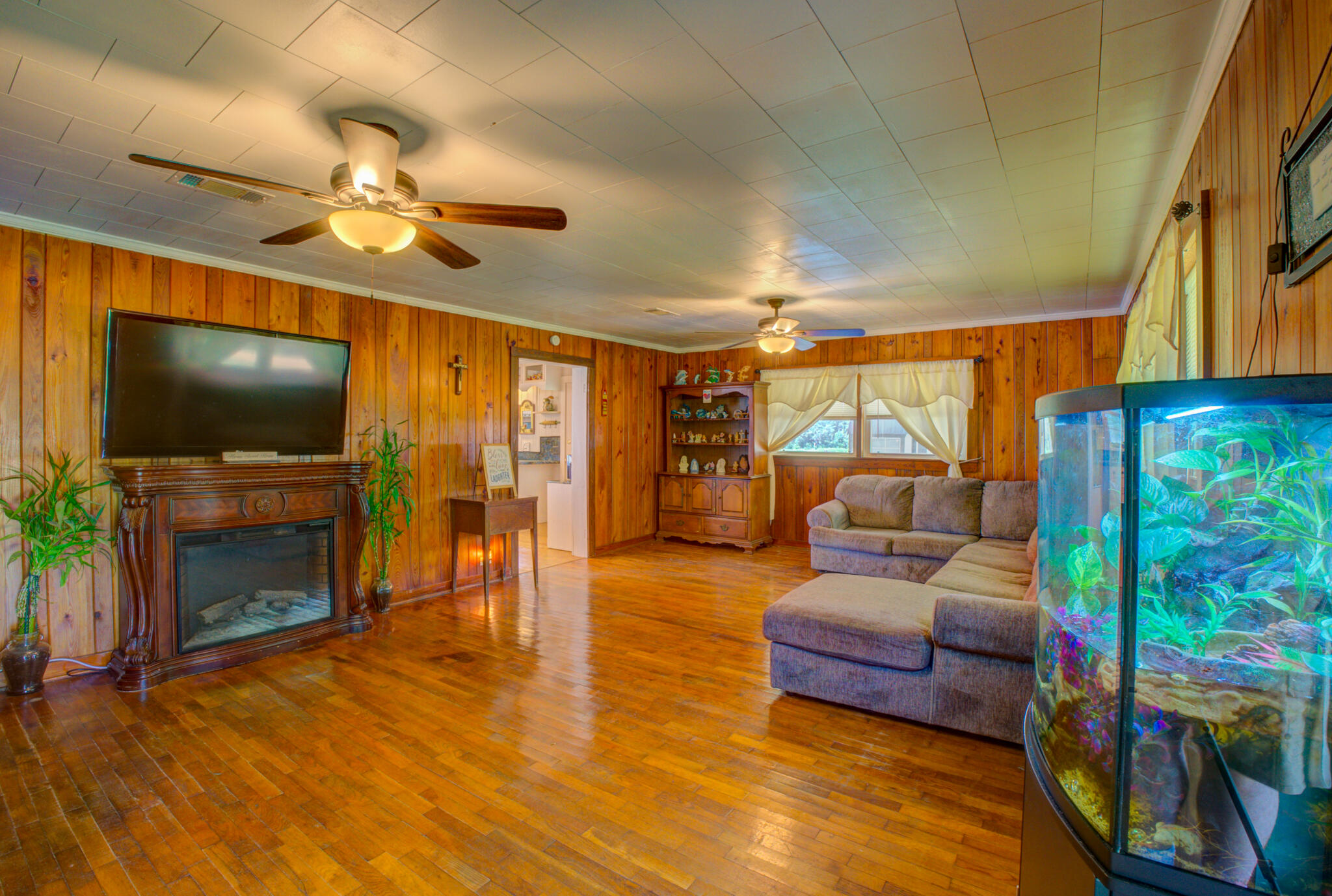 4135 Cliff Road Graceville, FL 32440 - Photo 3 of 40 a living room with fireplace furniture and a flat screen tv