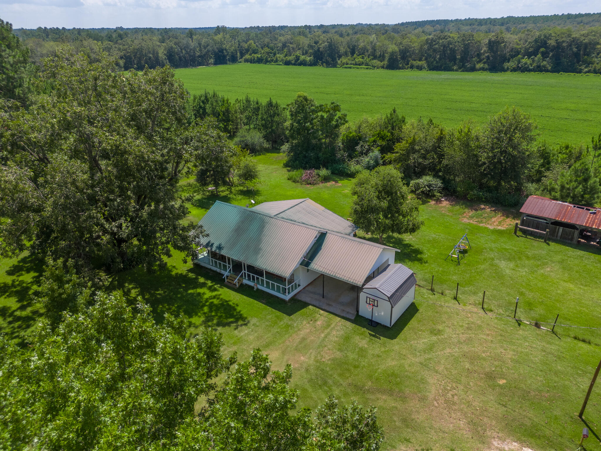 4135 Cliff Road Graceville, FL 32440 - Photo 36 of 40 a view of a house with a yard