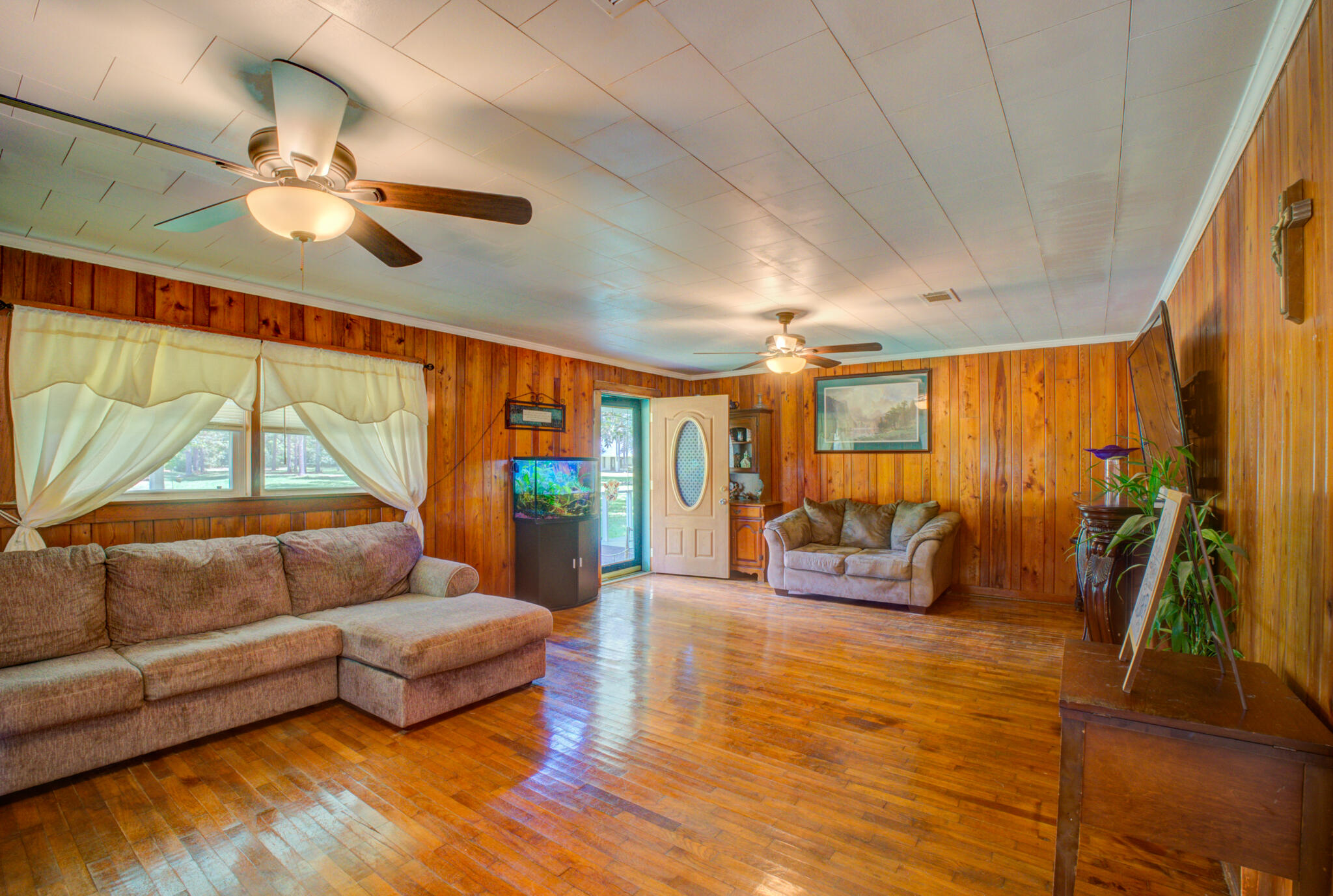 4135 Cliff Road Graceville, FL 32440 - Photo 5 of 40 a bedroom with furniture and a large window