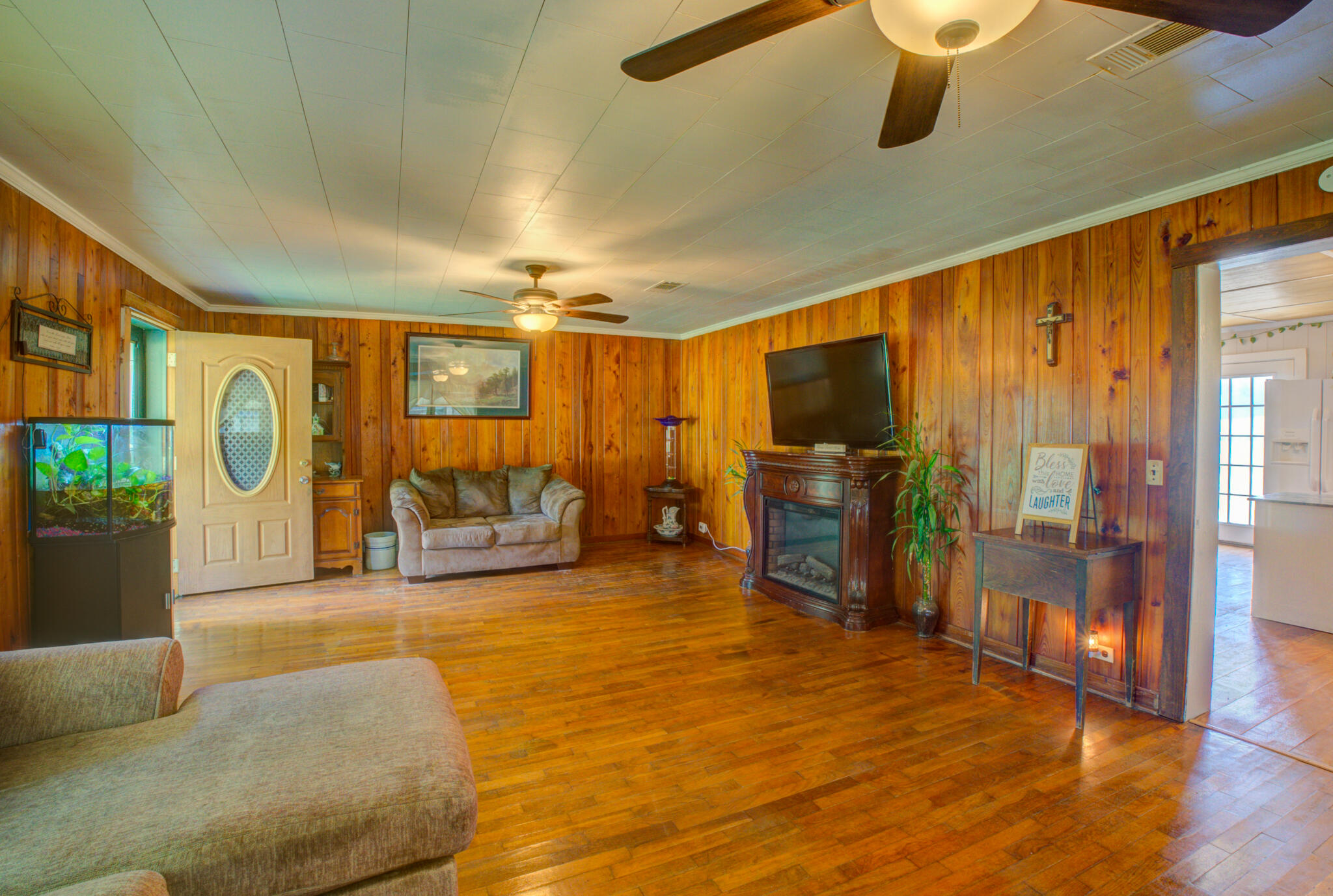 4135 Cliff Road Graceville, FL 32440 - Photo 6 of 40 a view of a livingroom with furniture and a flat screen tv