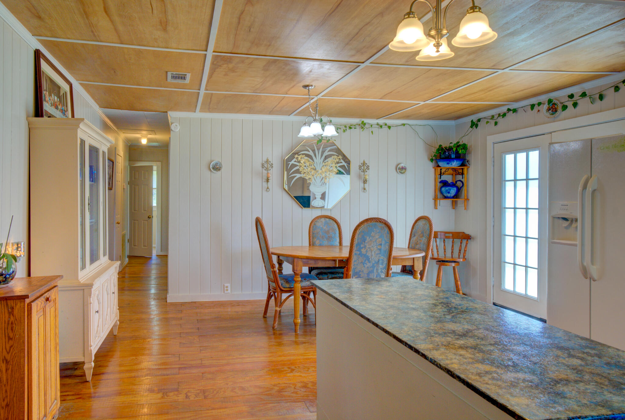 4135 Cliff Road Graceville, FL 32440 - Photo 7 of 40 a view of a dining room with furniture and chandelier