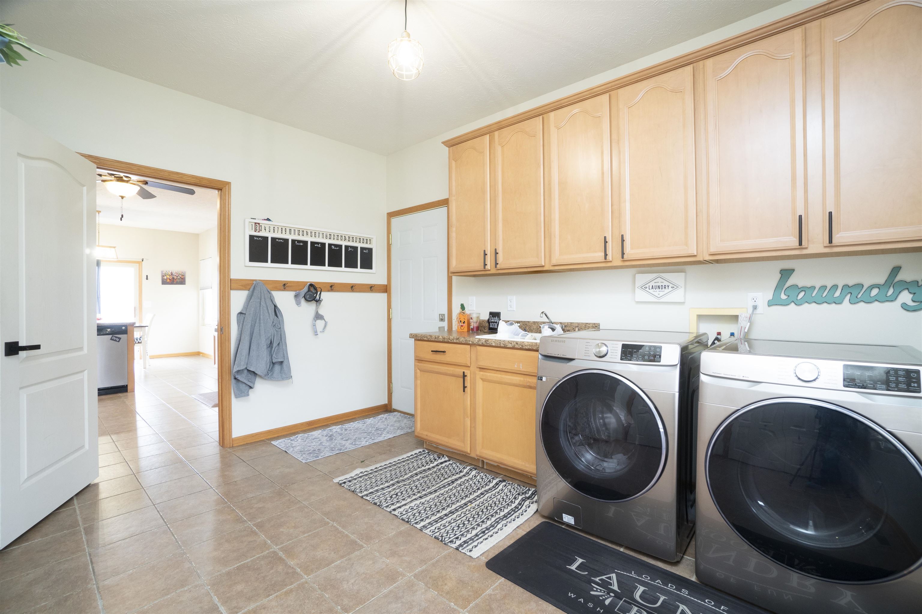 3271 North Silver Ridge Drive Oregon, IL 61061 - Photo 17 of 45 a view of kitchen and washer and dryer