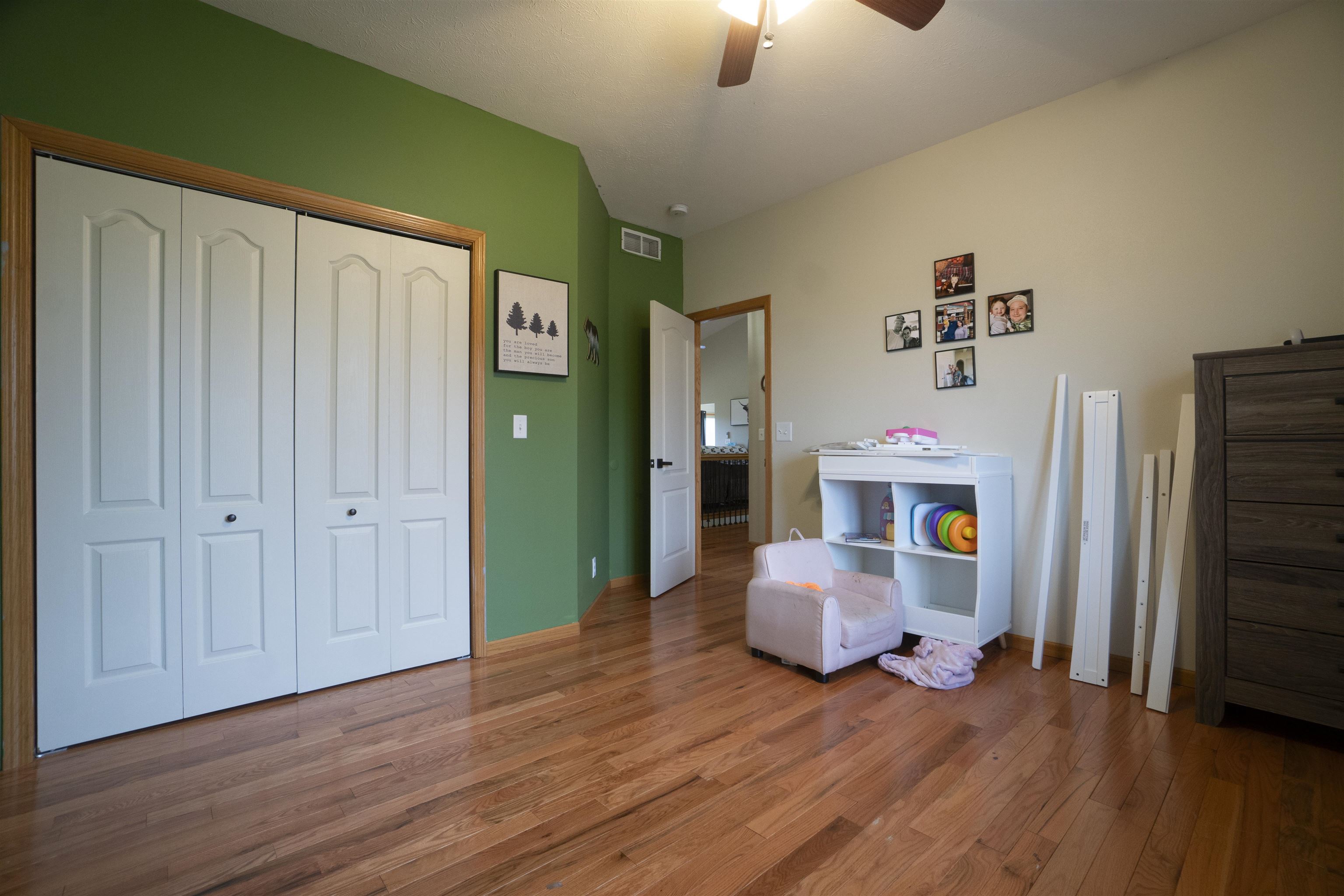 3271 North Silver Ridge Drive Oregon, IL 61061 - Photo 24 of 45 a hallway with furniture and wooden floor