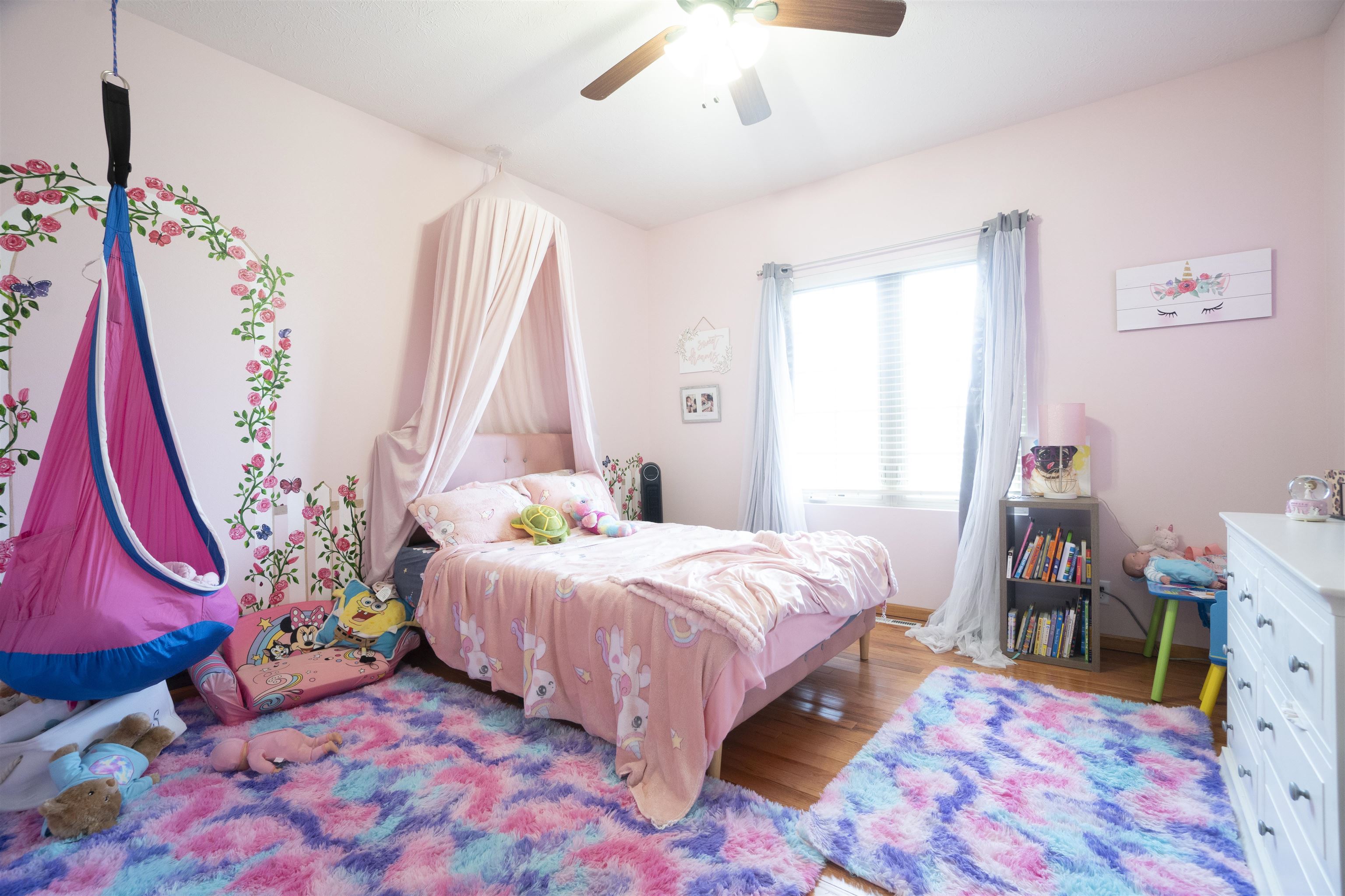3271 North Silver Ridge Drive Oregon, IL 61061 - Photo 25 of 45 a bedroom with a bed and a wooden floor