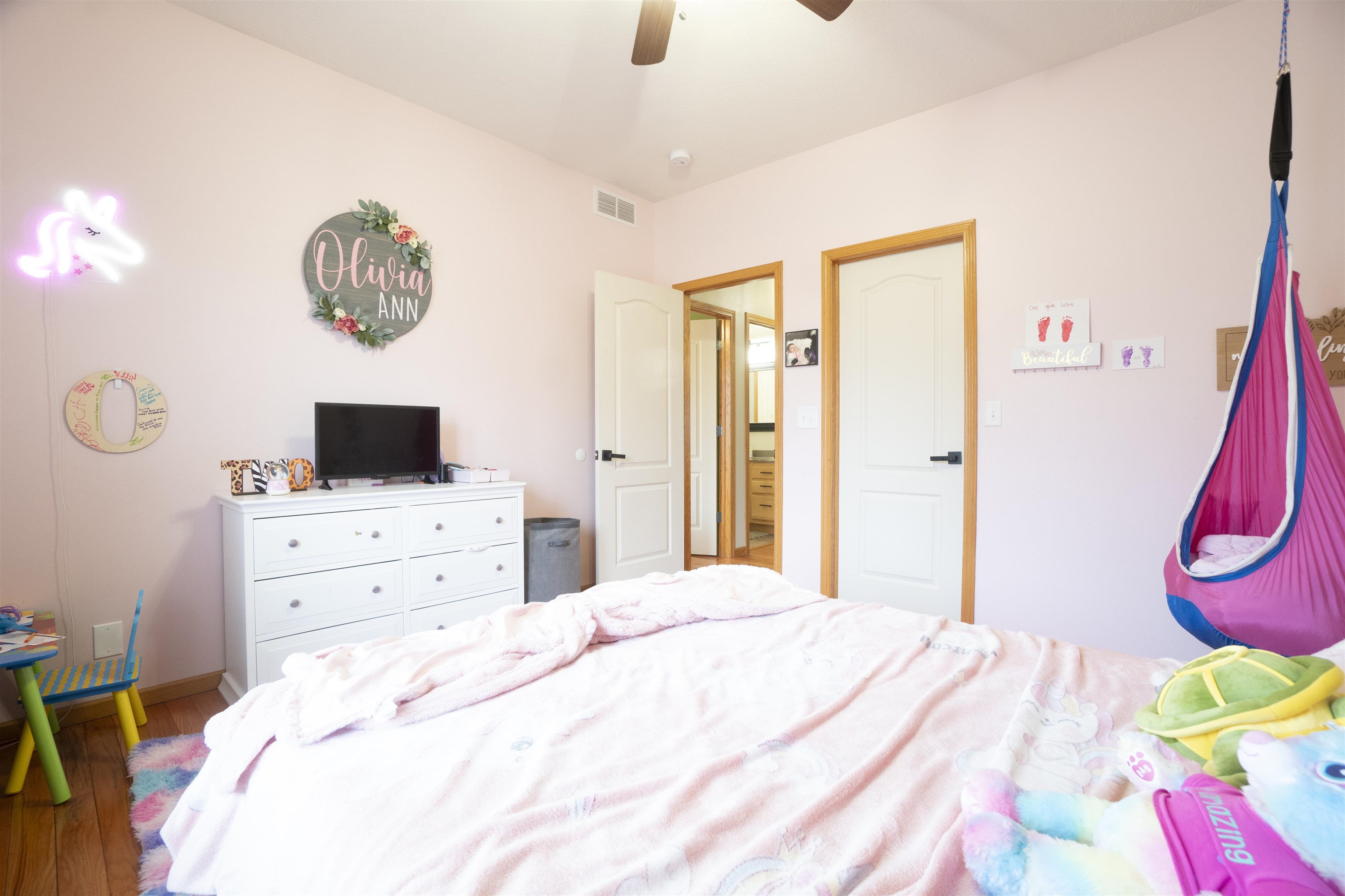 3271 North Silver Ridge Drive Oregon, IL 61061 - Photo 26 of 45 a bedroom with a bed a flat tv screen and a dresser