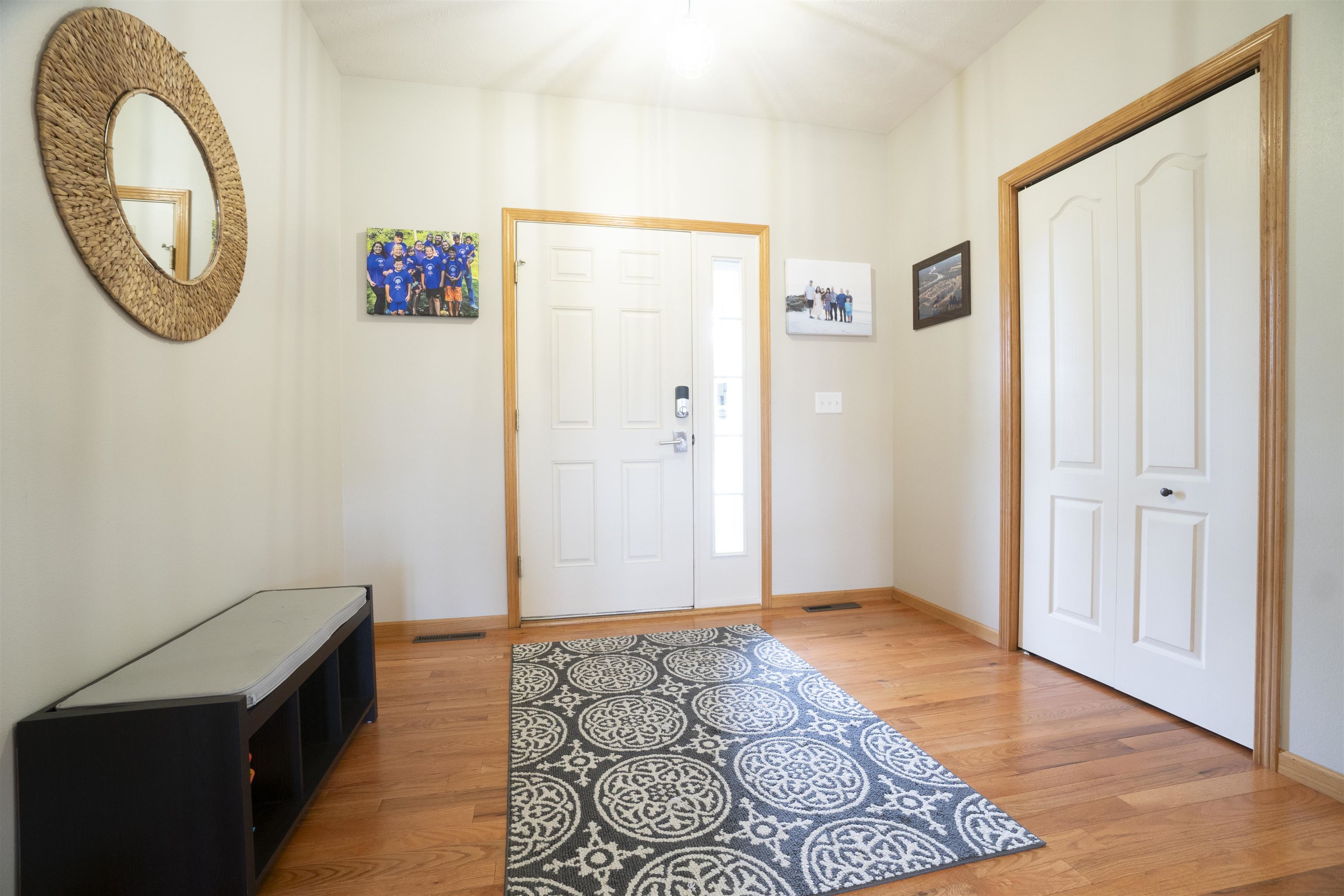 3271 North Silver Ridge Drive Oregon, IL 61061 - Photo 3 of 45 a view of a hallway with wooden floor and a potted plant
