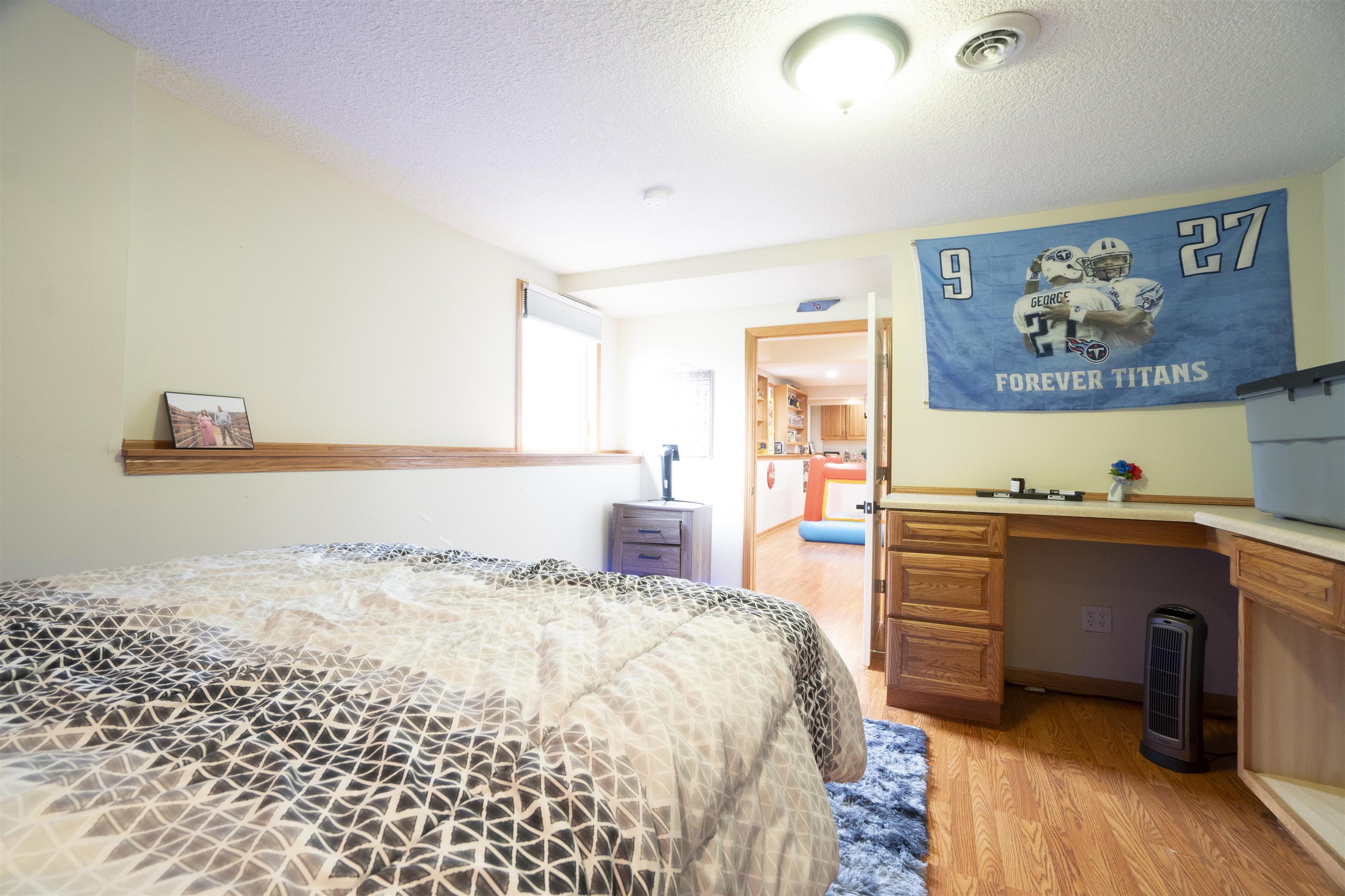 3271 North Silver Ridge Drive Oregon, IL 61061 - Photo 32 of 45 a bedroom with a bed and a desk