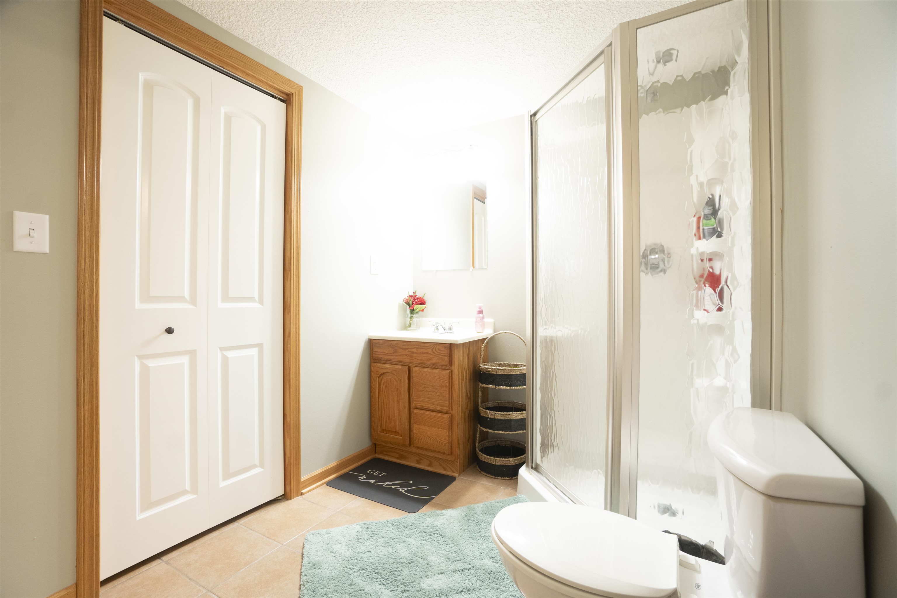 3271 North Silver Ridge Drive Oregon, IL 61061 - Photo 34 of 45 a bathroom with a toilet a sink and a mirror
