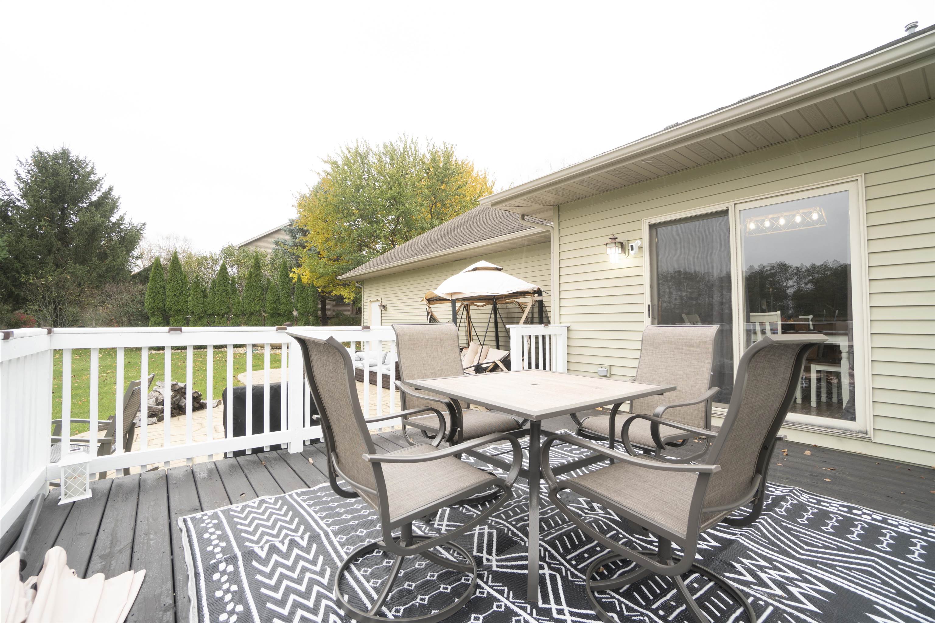 3271 North Silver Ridge Drive Oregon, IL 61061 - Photo 35 of 45 a view of a patio with a table and chairs