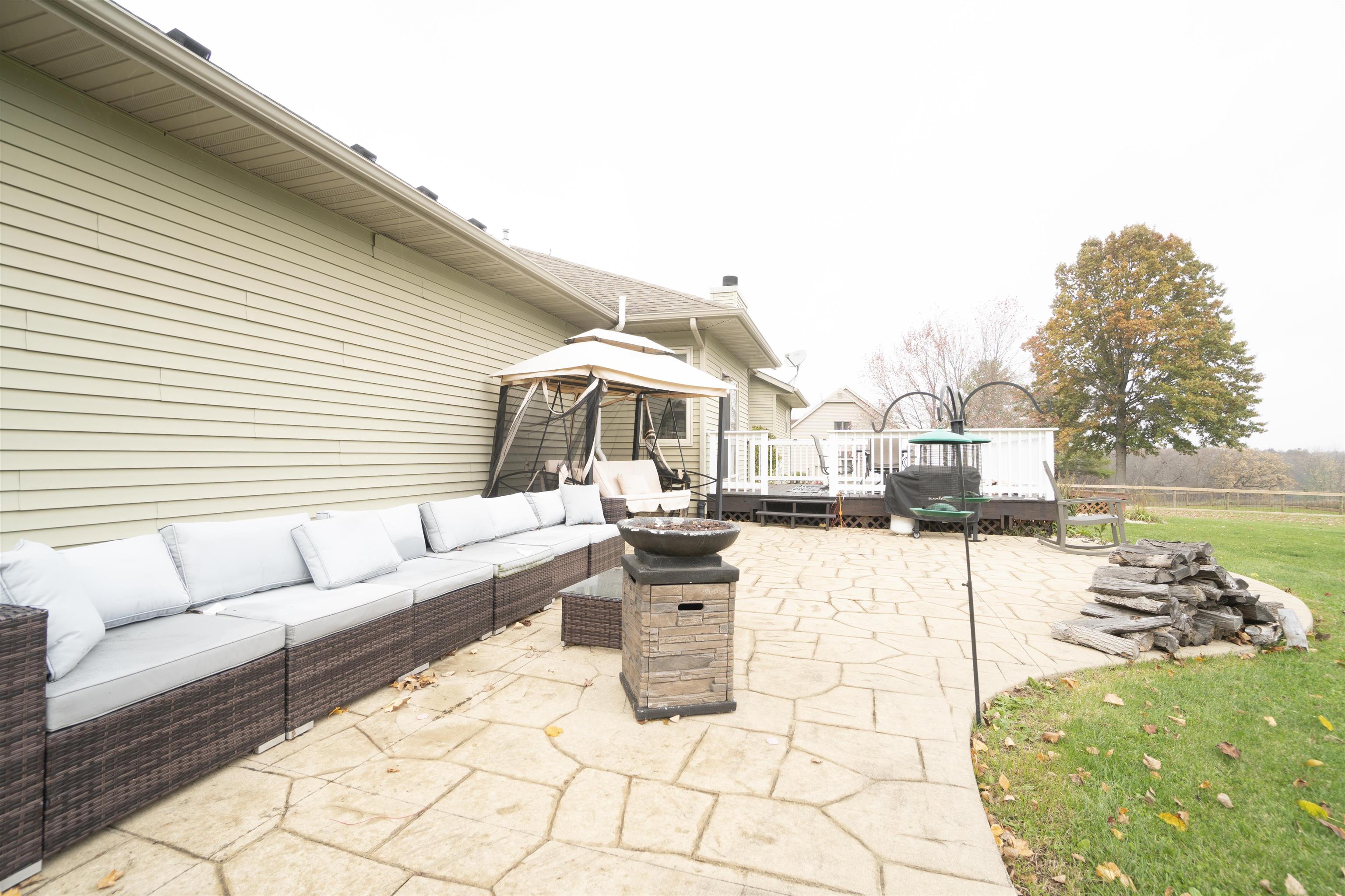 3271 North Silver Ridge Drive Oregon, IL 61061 - Photo 36 of 45 a view of a terrace with chairs and a table