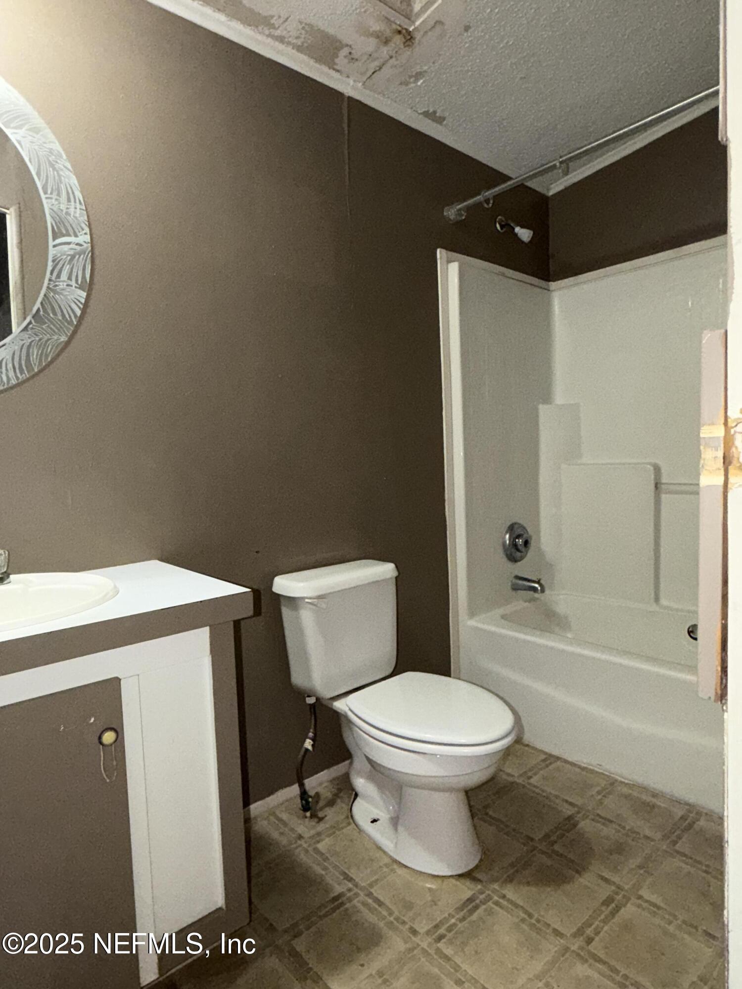 323 Incline Road Satsuma, FL 32189 - Photo 12 of 12 a bathroom with a toilet and a shower