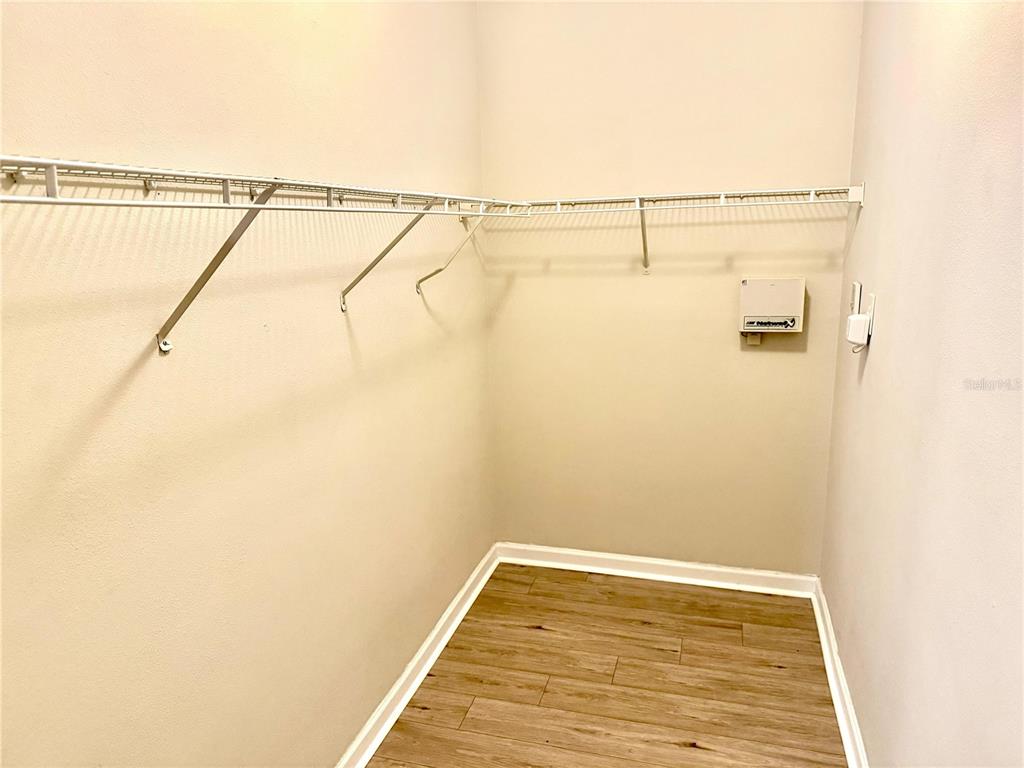 8842 Villa View Circle, Unit 3 Orlando, FL 32821 - Photo 11 of 21 a view of a walk in closet