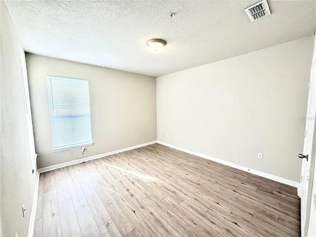 a bathroom with a toilet a sink and shower
