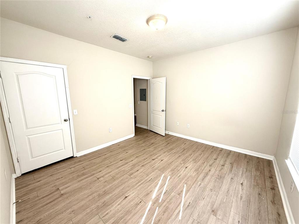 8842 Villa View Circle, Unit 3 Orlando, FL 32821 - Photo 17 of 21 wooden floor in an empty room