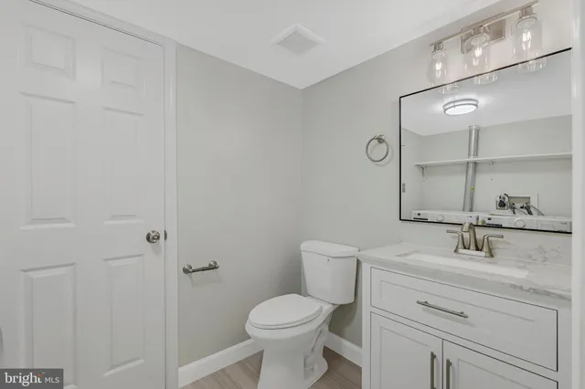 a view of a bathroom with wooden floor