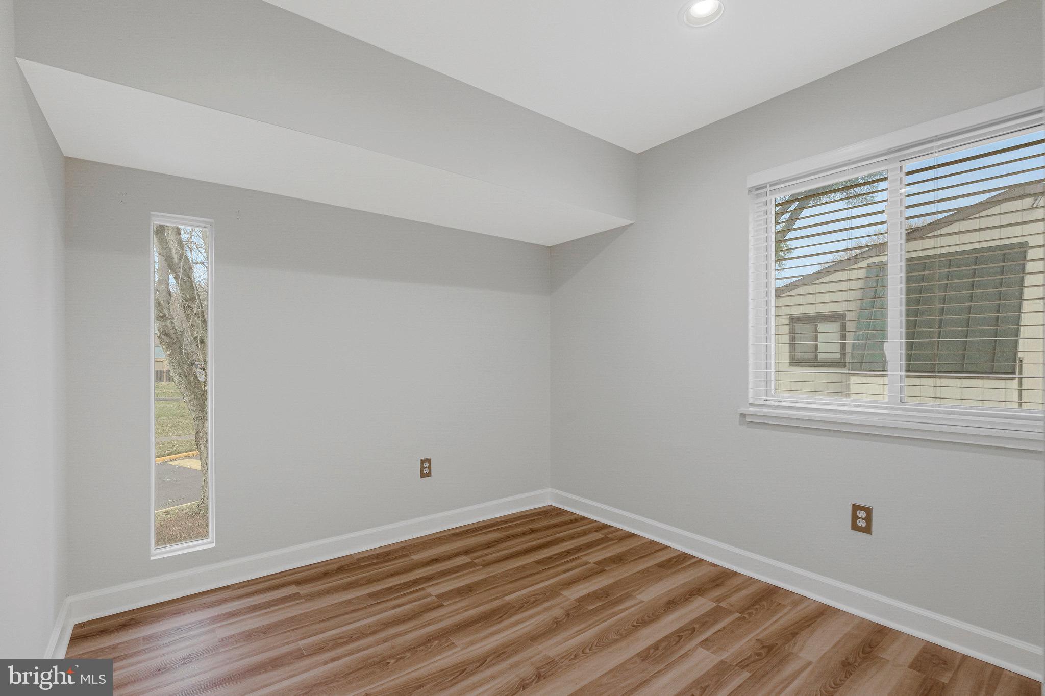 1801 Ivy Oak Square, Unit 65 Reston, VA 20190 - Photo 26 of 43 a view of empty room with wooden floor and fan