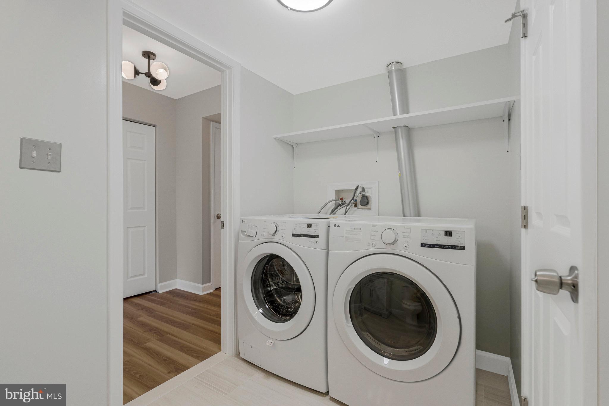 1801 Ivy Oak Square, Unit 65 Reston, VA 20190 - Photo 29 of 43 a utility room with dryer and washer