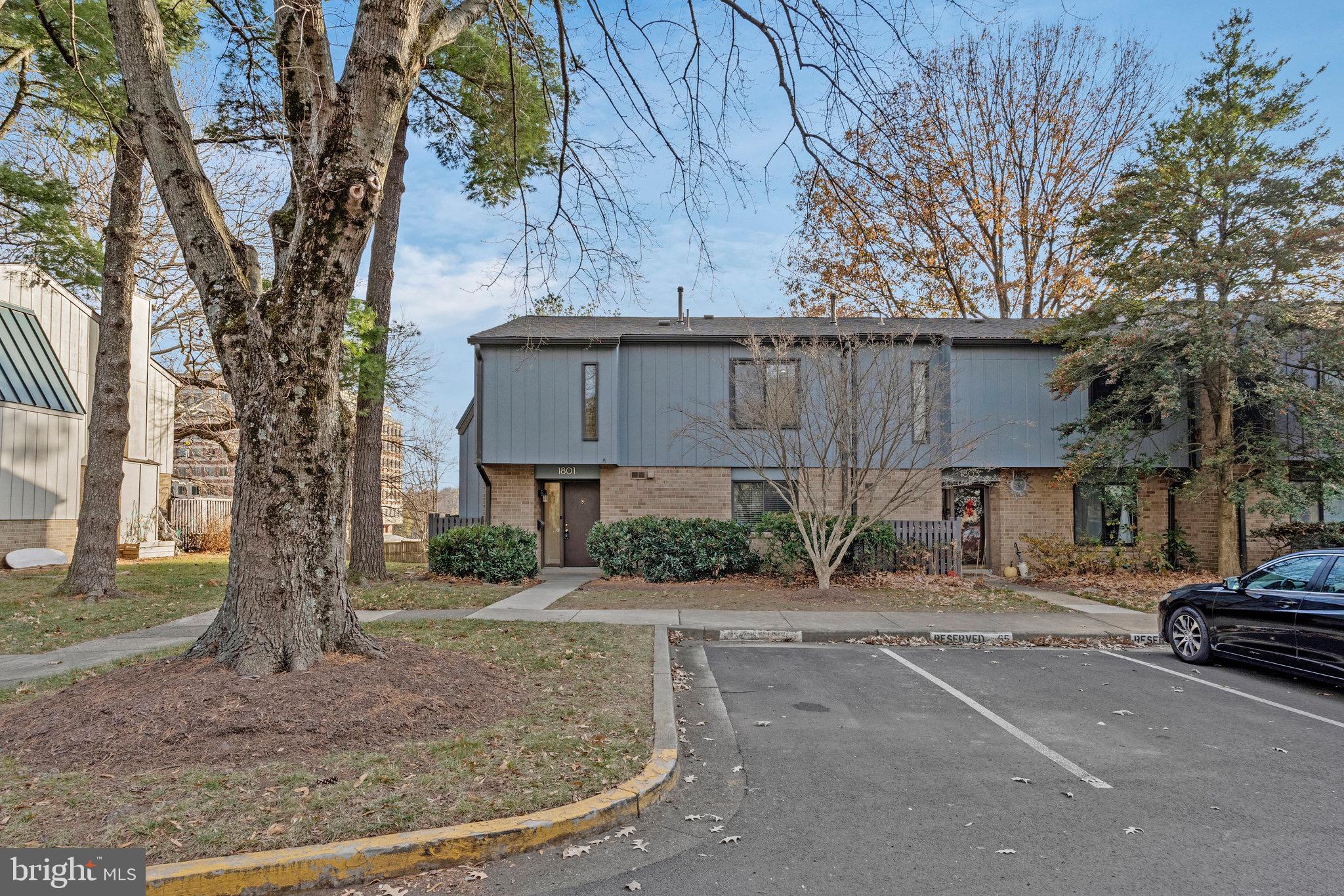 1801 Ivy Oak Square, Unit 65 Reston, VA 20190 - Photo 4 of 43 a view of a car park in front of house