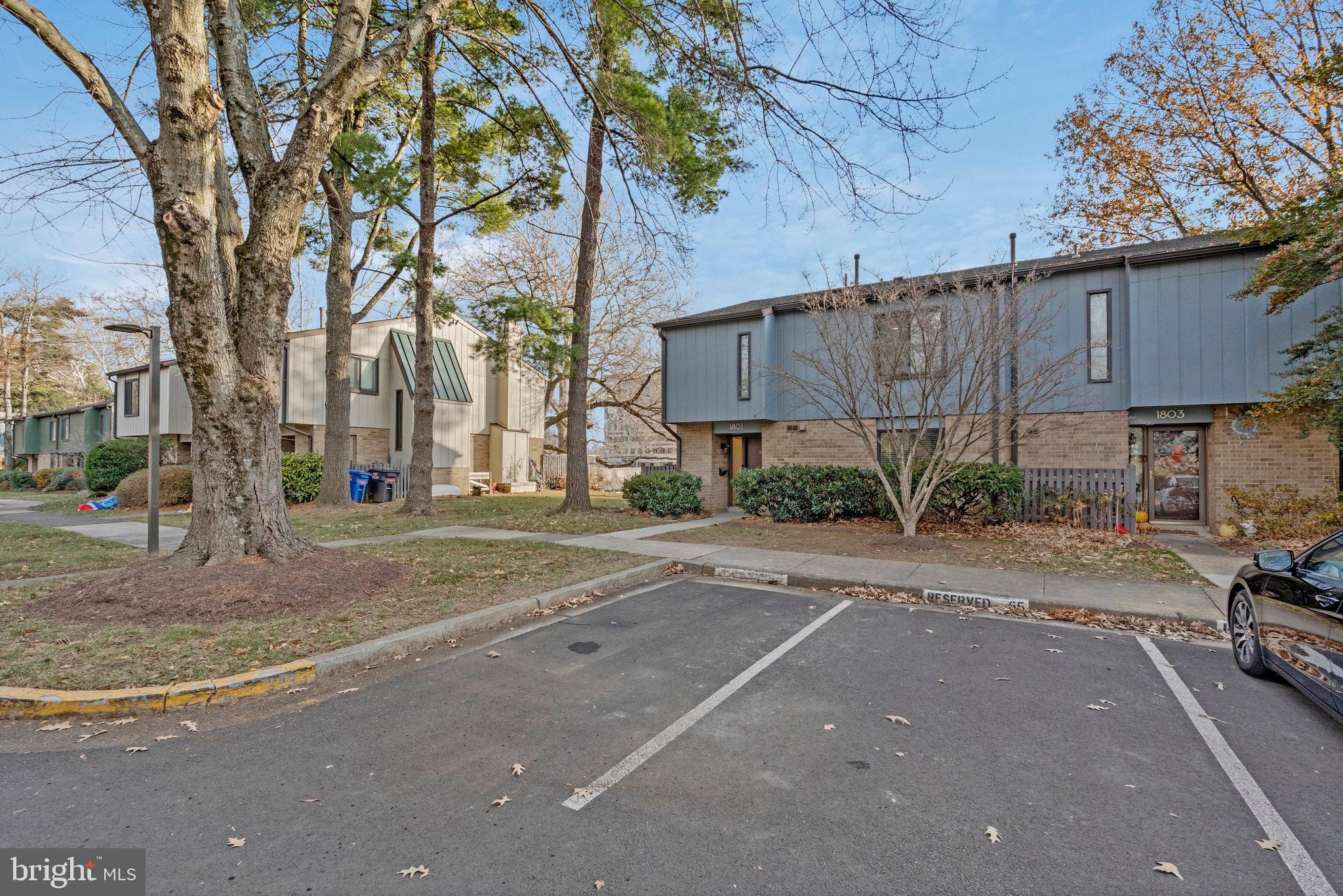 1801 Ivy Oak Square, Unit 65 Reston, VA 20190 - Photo 6 of 43 front view of a house with a street