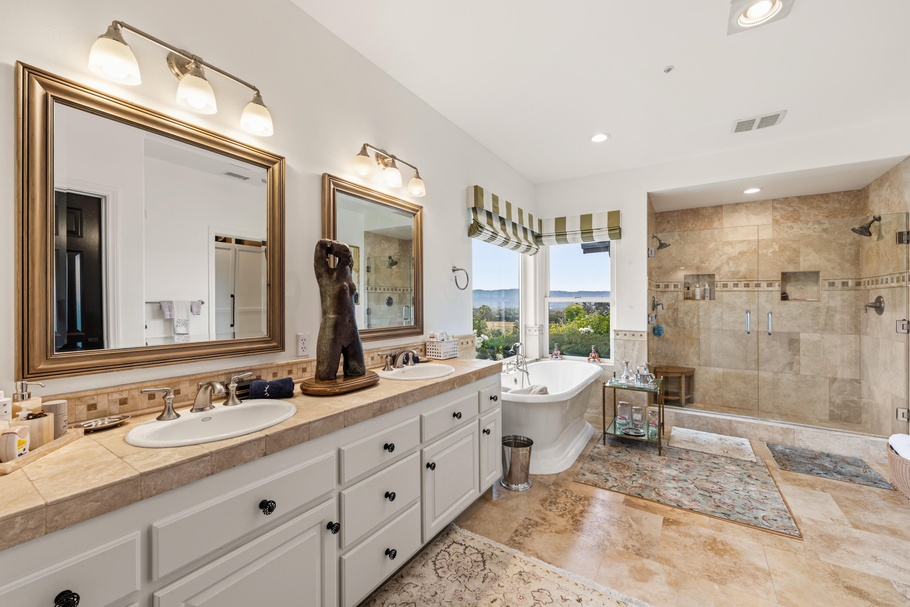 2502 Pepper Tree Ranch Road Santa Ynez, CA 93460 - Photo 11 of 32 a bathroom with a double vanity sink mirror double shower and a toilet