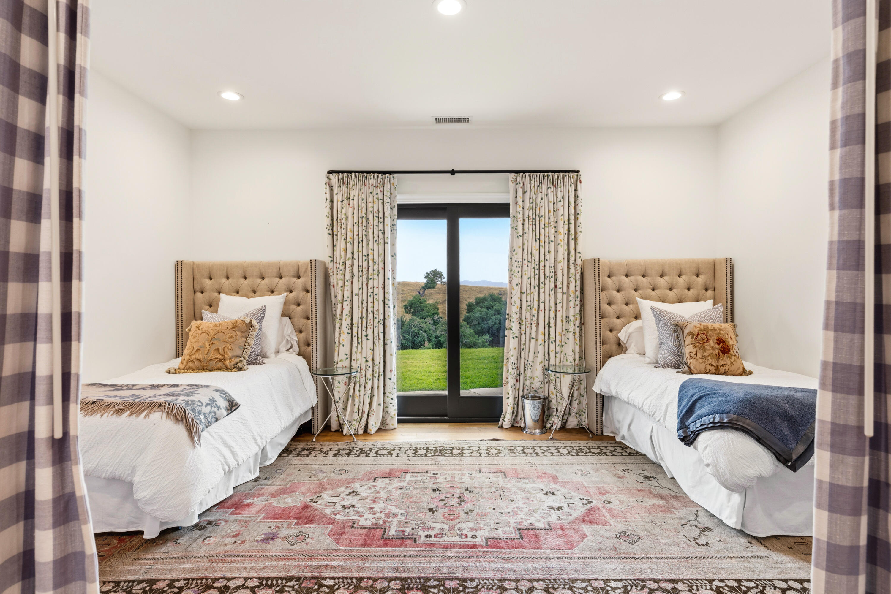 2502 Pepper Tree Ranch Road Santa Ynez, CA 93460 - Photo 16 of 32 a bedroom with a large bed and a window