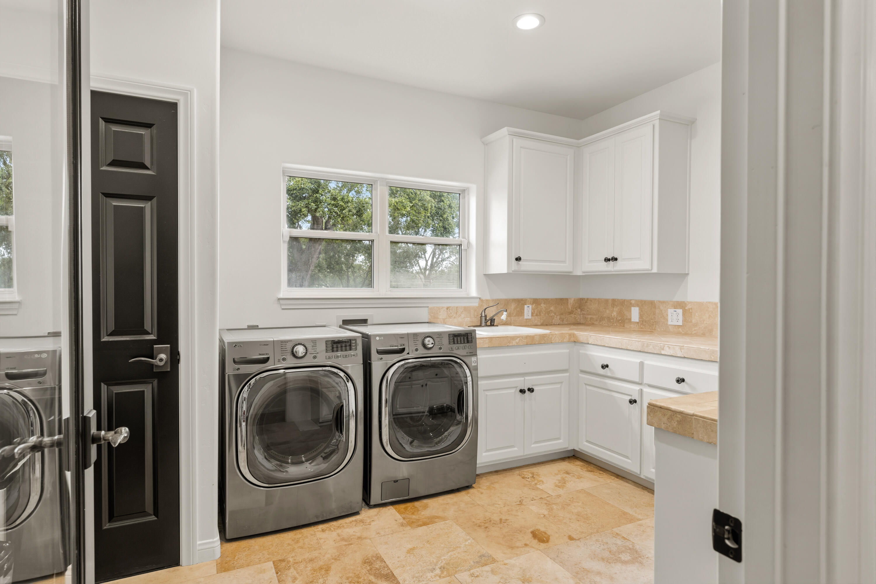 2502 Pepper Tree Ranch Road Santa Ynez, CA 93460 - Photo 20 of 32 a utility room with sink dryer and washer