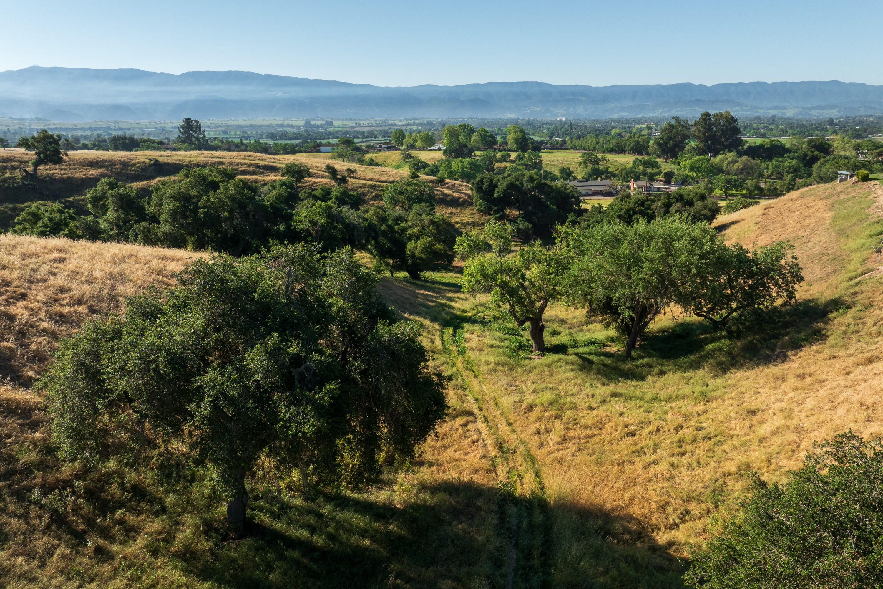 2502 Pepper Tree Ranch Road Santa Ynez, CA 93460 - Photo 26 of 32 a view of a lake with mountains in the background