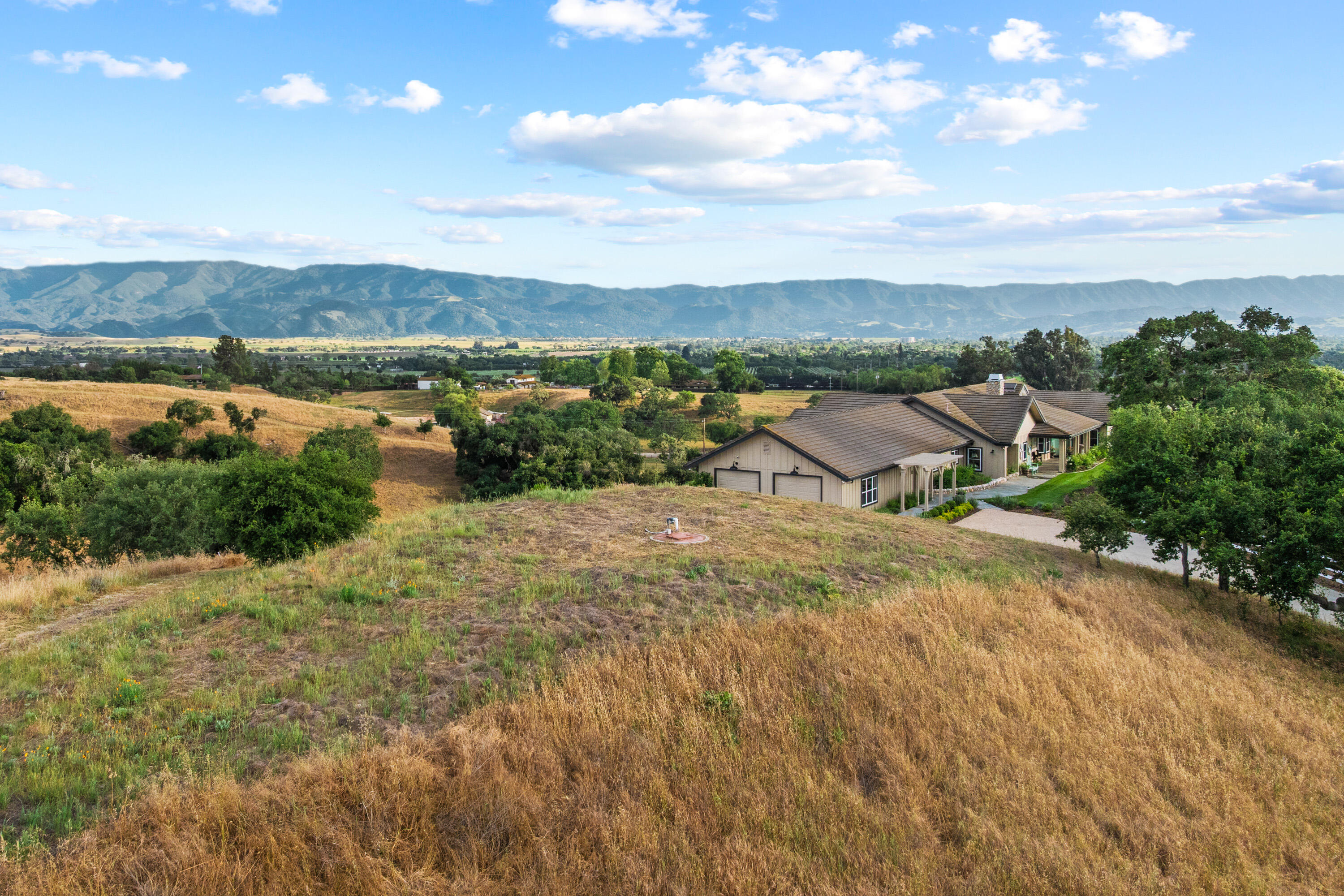 2502 Pepper Tree Ranch Road Santa Ynez, CA 93460 - Photo 28 of 32 an aerial view of a house with a yard and lake view