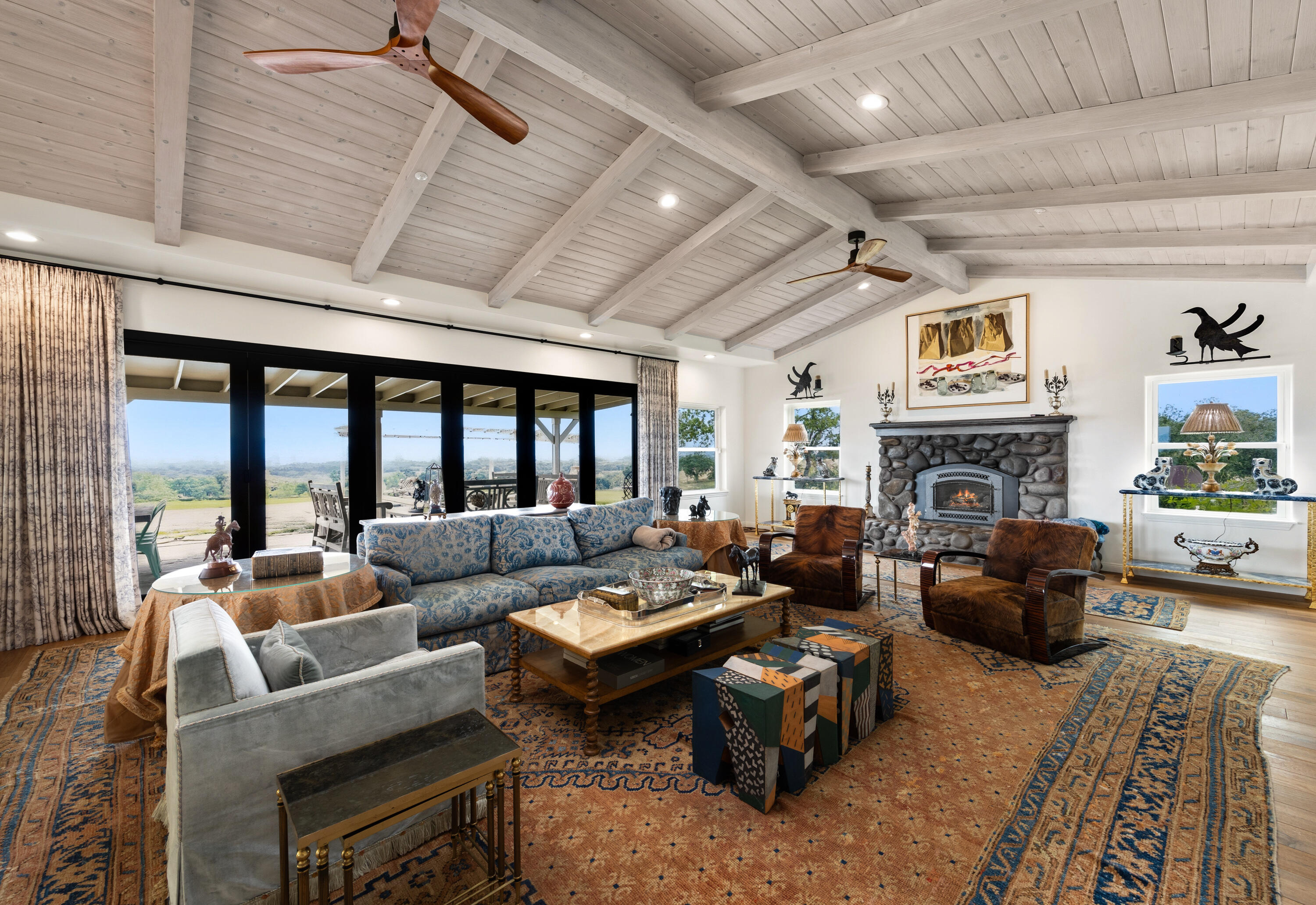 2502 Pepper Tree Ranch Road Santa Ynez, CA 93460 - Photo 3 of 32 a living room with furniture fireplace and a large window
