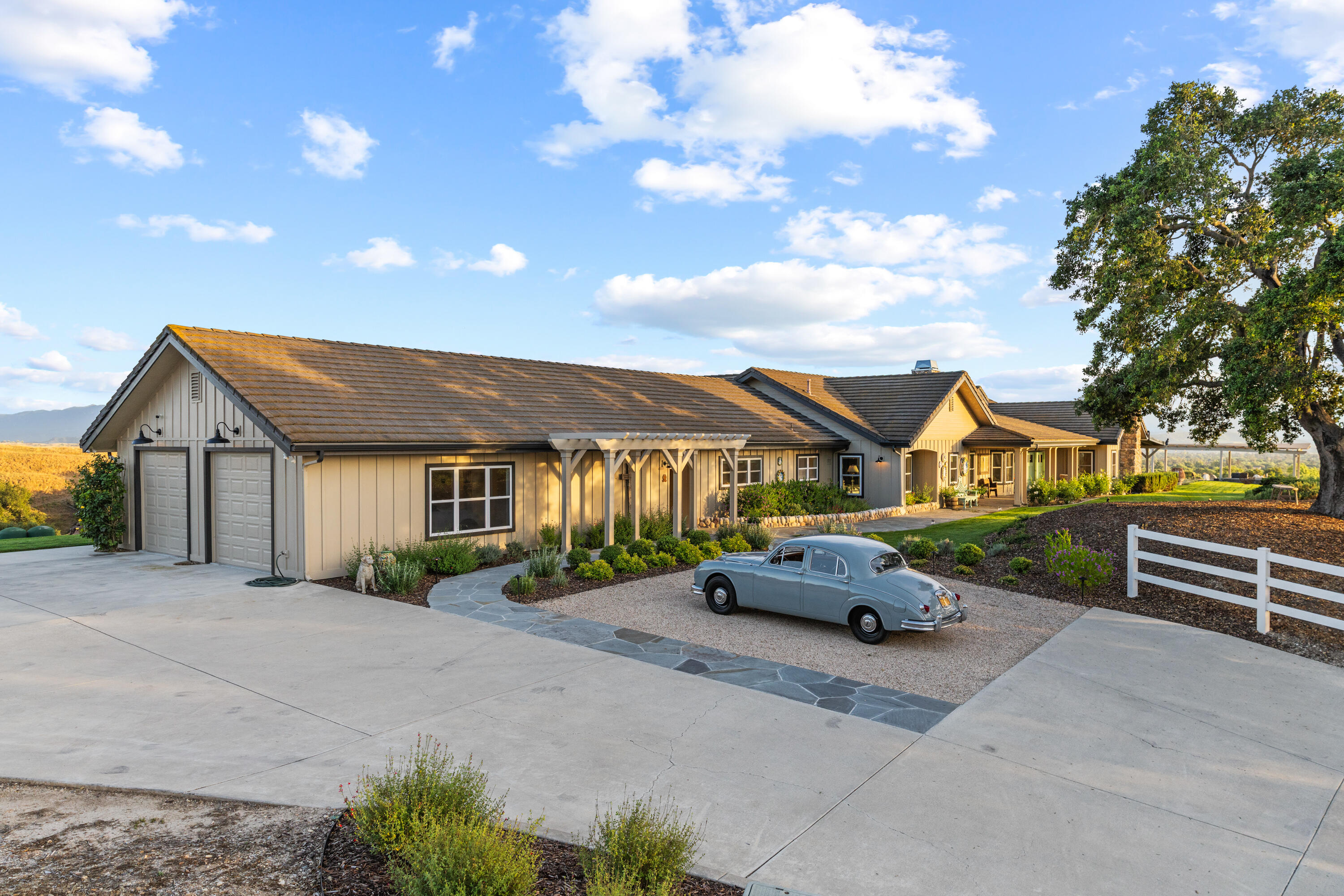2502 Pepper Tree Ranch Road Santa Ynez, CA 93460 - Photo 31 of 32 a car parked in front of house with a yard
