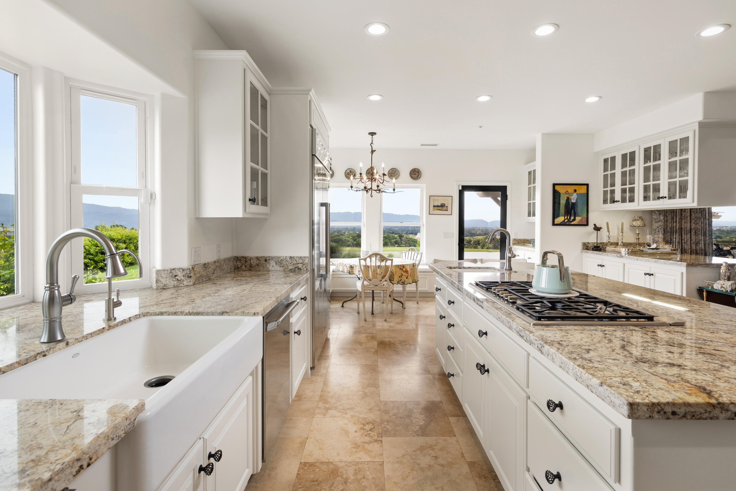 2502 Pepper Tree Ranch Road Santa Ynez, CA 93460 - Photo 6 of 32 a large kitchen with granite countertop a sink and cabinets