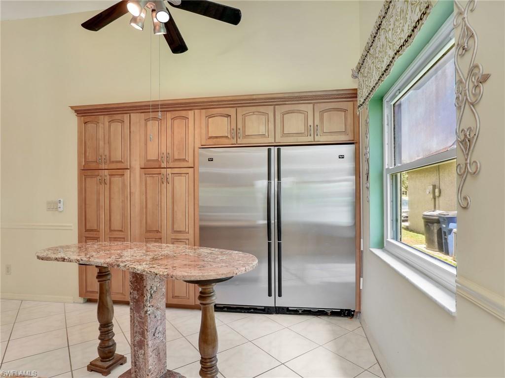 13243 Heather Ridge Loop Fort Myers, FL 33966 - Photo 14 of 34 a kitchen with stainless steel appliances granite countertop a refrigerator and a sink