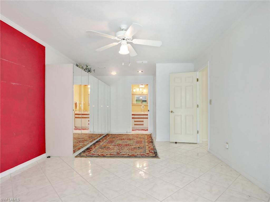 13243 Heather Ridge Loop Fort Myers, FL 33966 - Photo 20 of 34 a view of a livingroom with a chandelier fan and a window