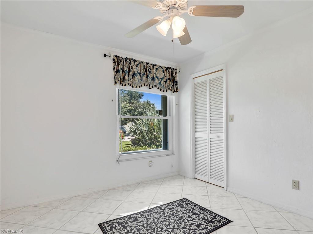 13243 Heather Ridge Loop Fort Myers, FL 33966 - Photo 24 of 34 an empty room with windows and fan
