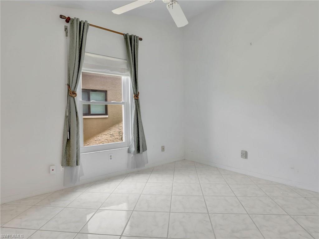 13243 Heather Ridge Loop Fort Myers, FL 33966 - Photo 26 of 34 an empty room with mirror