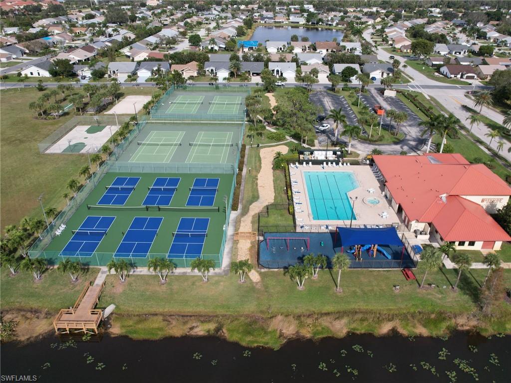 13243 Heather Ridge Loop Fort Myers, FL 33966 - Photo 30 of 34 an aerial view of residential houses with outdoor space