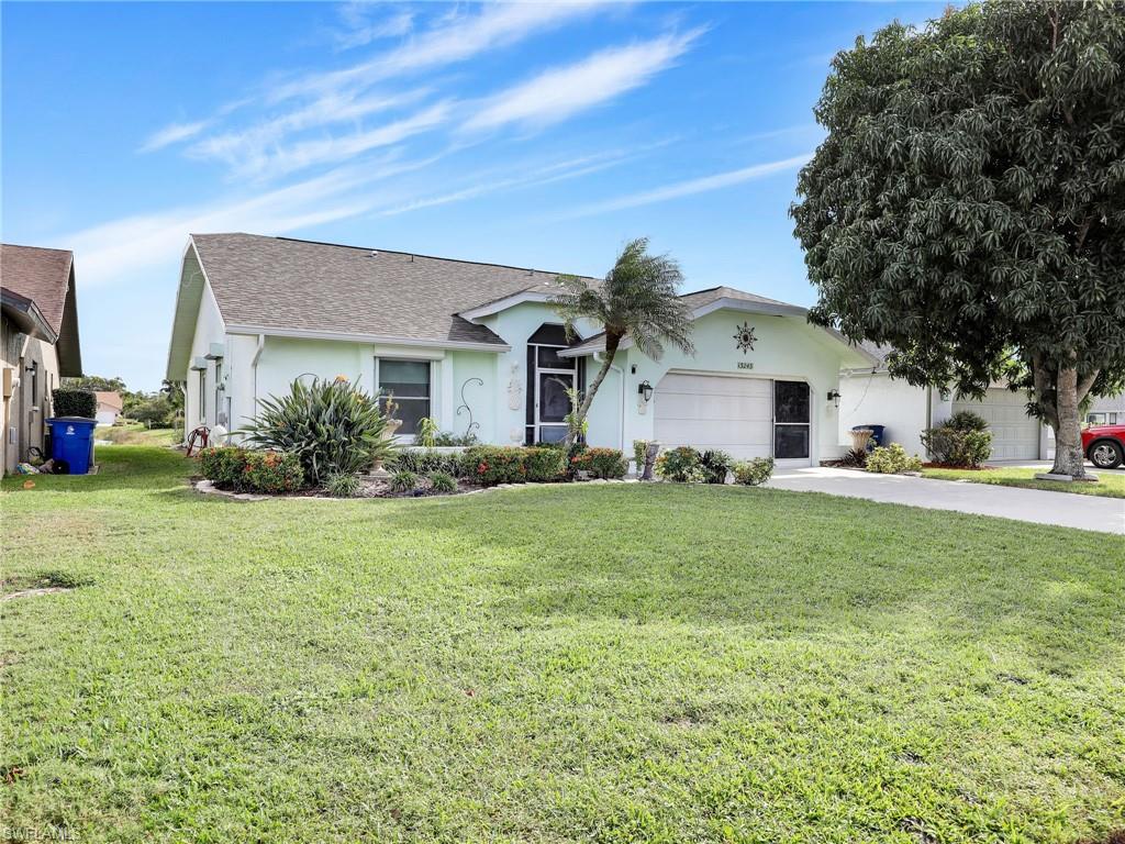 13243 Heather Ridge Loop Fort Myers, FL 33966 - Photo 34 of 34 a front view of house with yard and trees